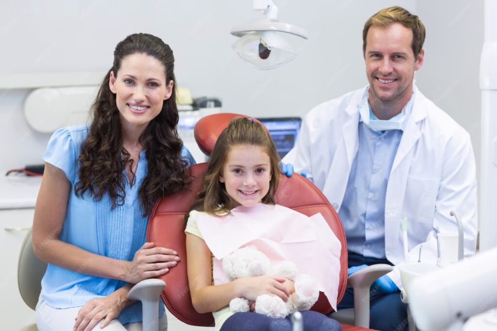 Family dental visit at Laguna Niguel Dental with Dr. Azadeh Ashtiany, featuring a smiling mother and daughter in a dental chair, showcasing a welcoming atmosphere for comprehensive family and cosmetic care.