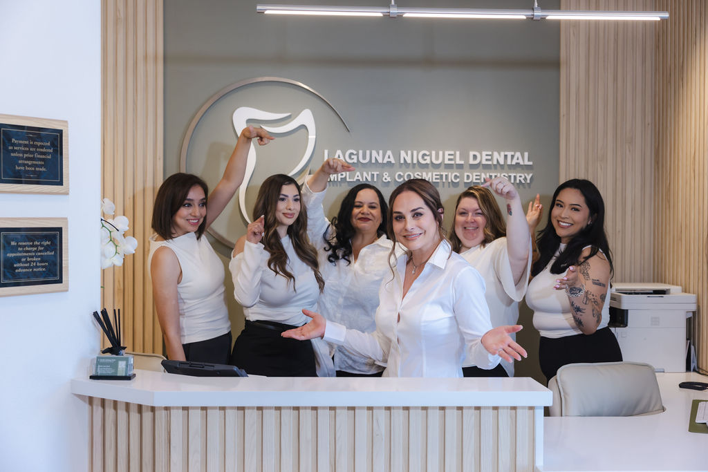 Dr Ashtiany and office staff welcoming patient to Laguna Niguel Dental
