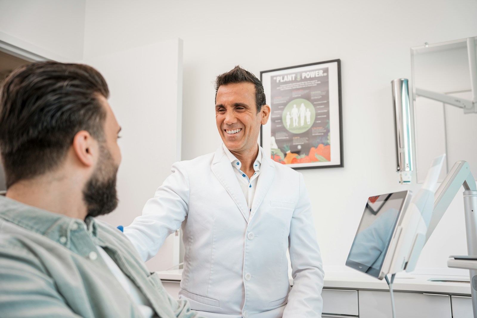 Aliso Viejo patient discussing dental implant treatment plan with dentist at Laguna Niguel Dental